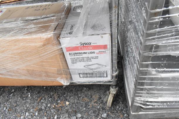 Chrome finish wire shelving unit on commercial casters, wrapped with Sysco Classic aluminum lids. Buyer must dismantle.