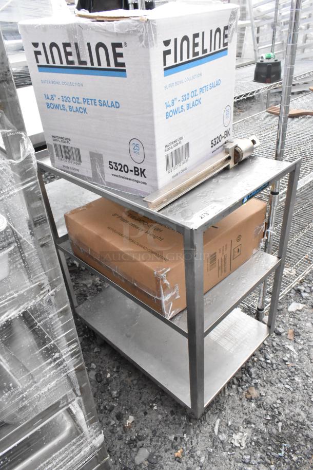 Metal 3-tier cart with box of Fineline salad bowls and commercial can opener. Good condition, sturdy shelves, grey finish.