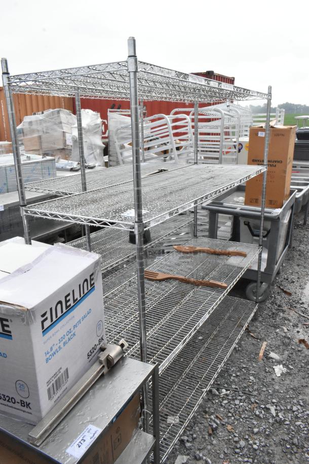 Chrome finish 4-tier wire shelving unit, moderate wear, buyer must dismantle. Consider freight charges.
