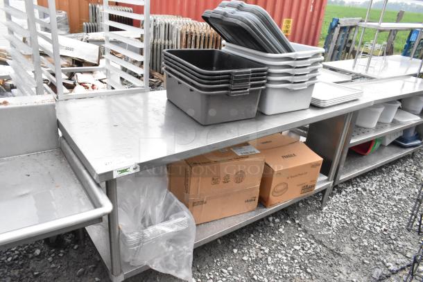 Regency 600TS3072S stainless steel table with under shelf, includes poly bus bins, boxes, and other contents.