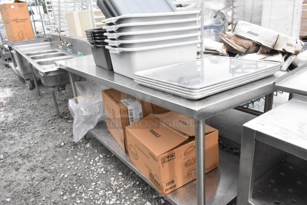Regency 600TS3072S stainless steel table with under shelf, includes poly bus bins and cardboard boxes, good condition.