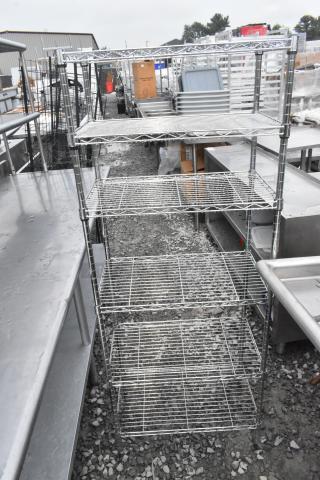 Chrome finish 6-tier wire shelving unit, excellent condition, sturdy design. Buyer must dismantle; consider freight charges.