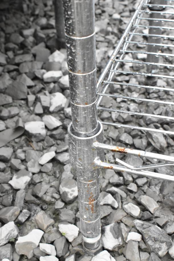 Chrome finish 6 tier wire shelving unit, corner post detail, shows some rust. Buyer must dismantle.