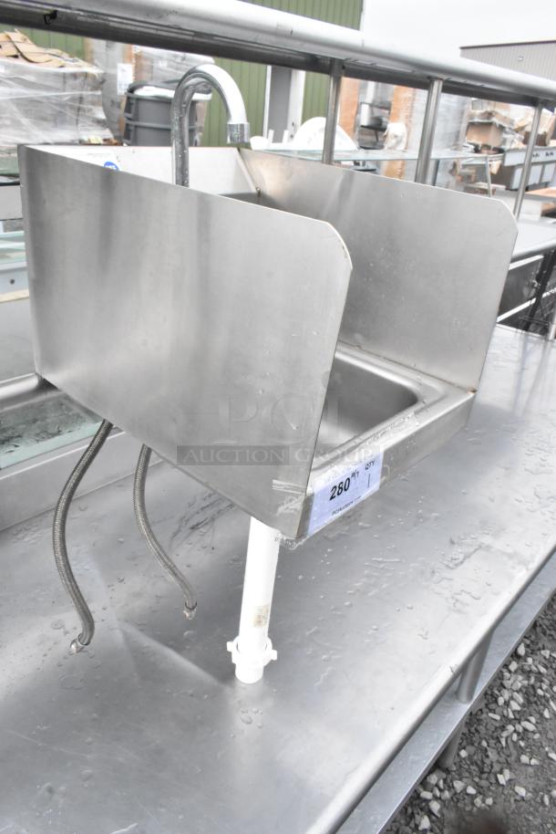 Stainless steel single bay sink with faucet, handles, and plumbing attachments, in used condition.