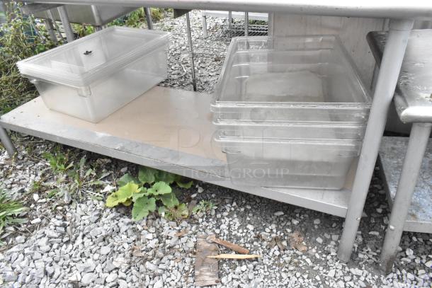 Stainless steel table with metal under shelf and two-tier over shelf, includes transparent storage containers.