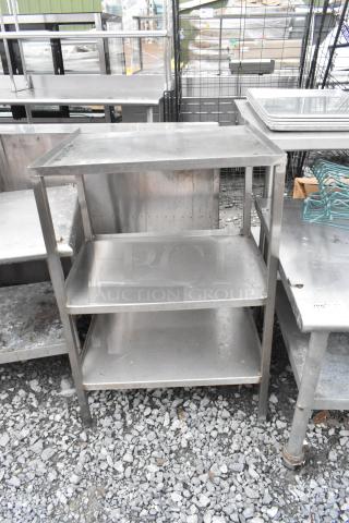 Metal 3 Tier Unit, industrial style, stainless steel, shows minor wear, three shelves, suitable for storage or display.