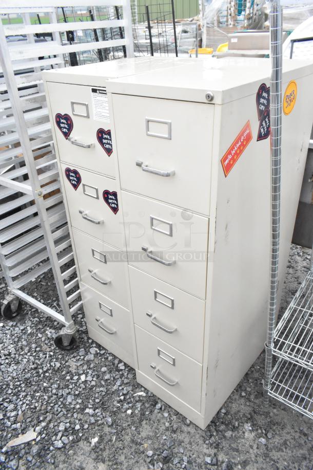 Two beige metal 4-drawer filing cabinets with labels and handle pulls. Used condition with stickers. Ideal for office storage.