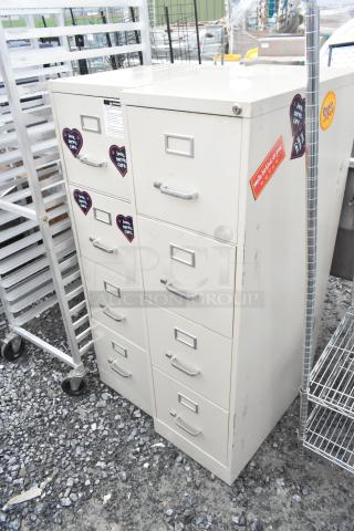 Two beige metal 4-drawer filing cabinets with labels and handle pulls. Used condition with stickers. Ideal for office storage.