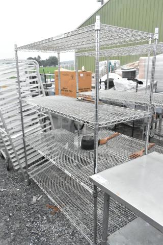 Chrome finish 4-tier wire shelving unit, dismantling required, ideal for storage, sturdy condition, consider freight costs.