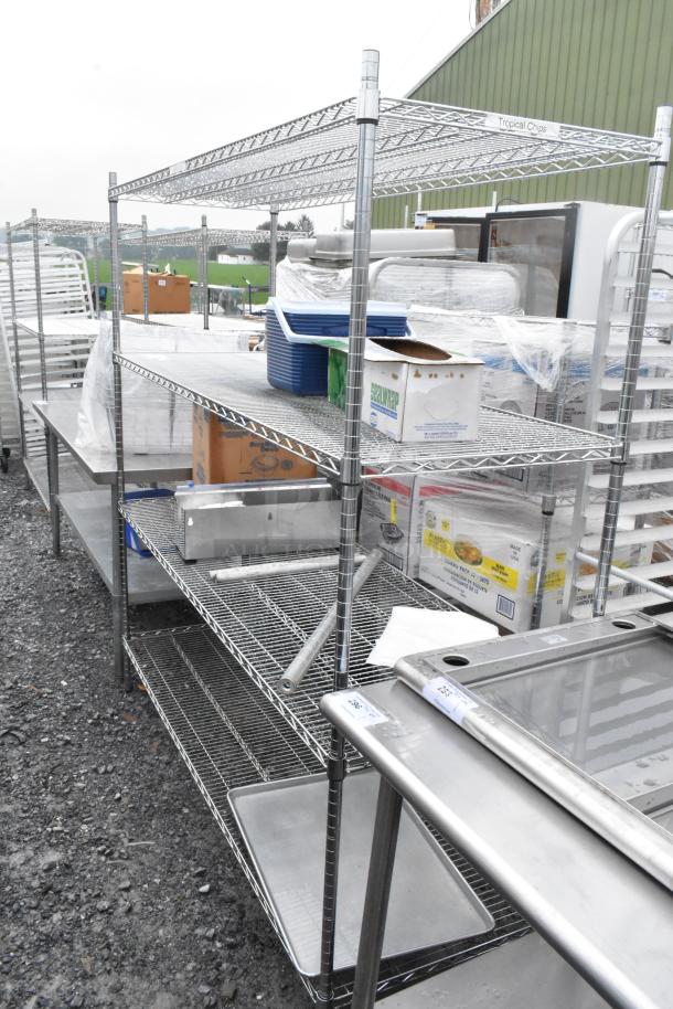 Chrome finish 4-tier wire shelving unit with assorted contents, buyer must dismantle, freight charges applicable.