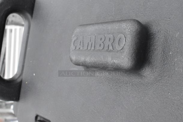 Cambro black poly beverage dispenser with textured finish and visible branding. Durable and ideal for catering events.