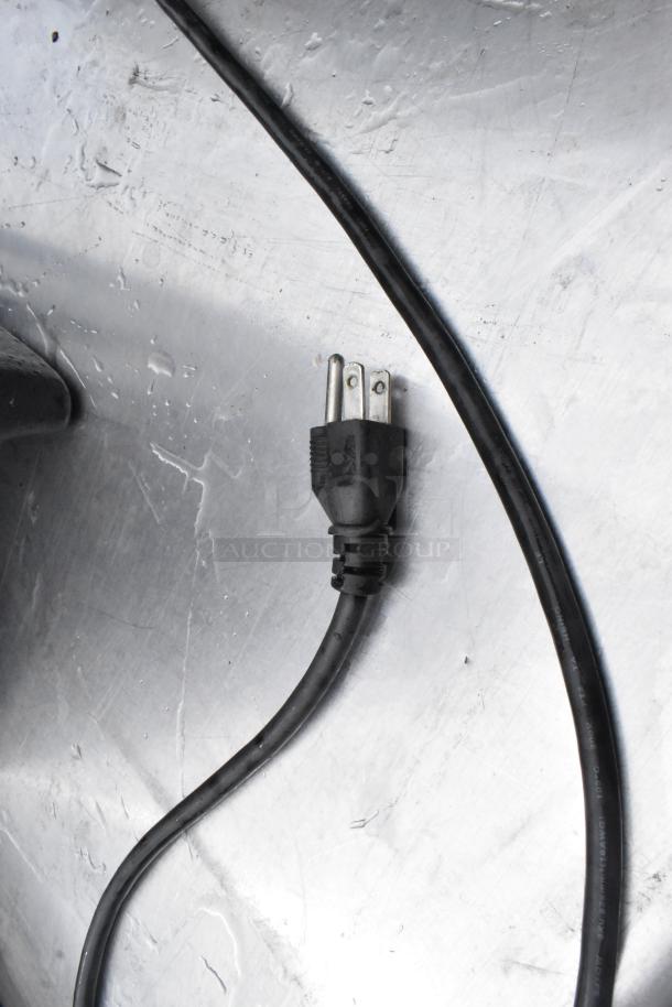 Vollrath Cayenne 1001 metal food warmer power cord, showing 3-prong plug on metallic surface; 120 volts, 1 phase.