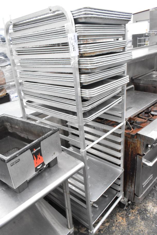 Metal commercial transport pan rack with 35 full-size baking pans on casters. Slight wear visible, tag reads "Lot 297."