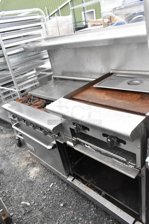 American Range stainless steel commercial gas range with 6 burners, right side flat top griddle, 2 ovens, over shelf, backsplash.