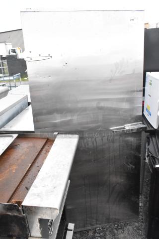 Stainless steel door, polished finish, visible hinges and handle. Minor surface stains; priced at $299. Suitable for commercial use.