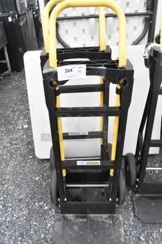 2 Harper PJDV2223A furniture dollies with yellow handles and black frames; label indicates "304" lot number.