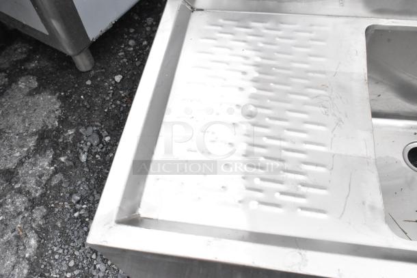 Regency 600B11014213 stainless steel back bar sink, single bay, dual drain boards, no legs, used condition.