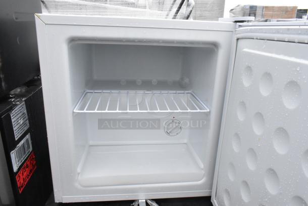 Four mini coolers: Accucold Freezer, Galanz GL43S5, Midea WHS-65LB1, GE WMR04GAVBBB. 120V, 1 phase, used. Knob visible inside.