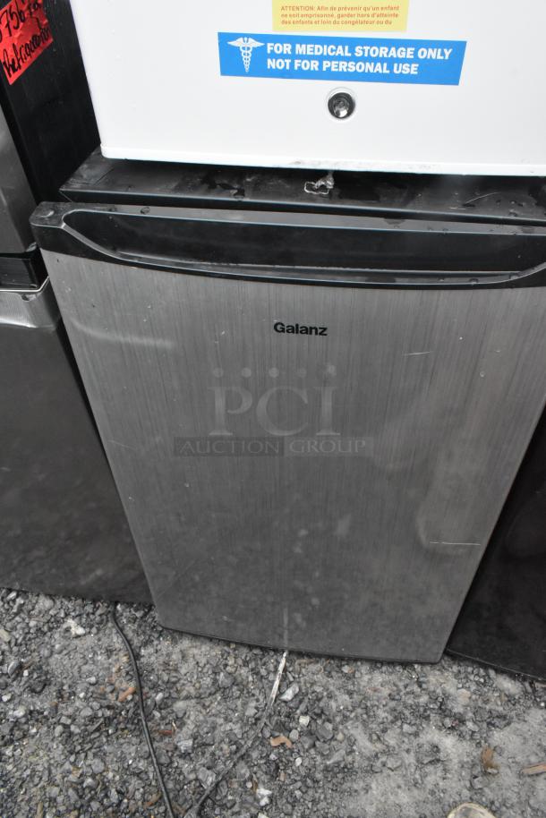 Four mini coolers including Accucold, Galanz GL43S5, Midea WHS-65LB1, GE WMR04GAVBBB, 120V, 1 phase, used condition.