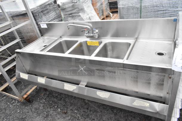 Perlick stainless steel 3 bay back bar sink with dual drain boards, Speedwell faucet, and handles. Appears in good condition.