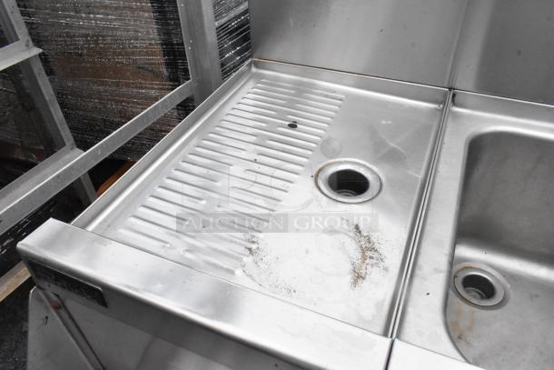 Perlick stainless steel 3 bay back bar sink with dual drain boards, Speedwell faucet, and handles, showing wear.