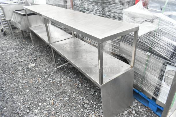 Metal 2-tier over shelf with open design, industrial-grade stainless steel, in good condition, suitable for commercial use.