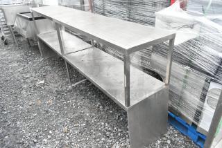 Metal 2-tier over shelf with open design, industrial-grade stainless steel, in good condition, suitable for commercial use.