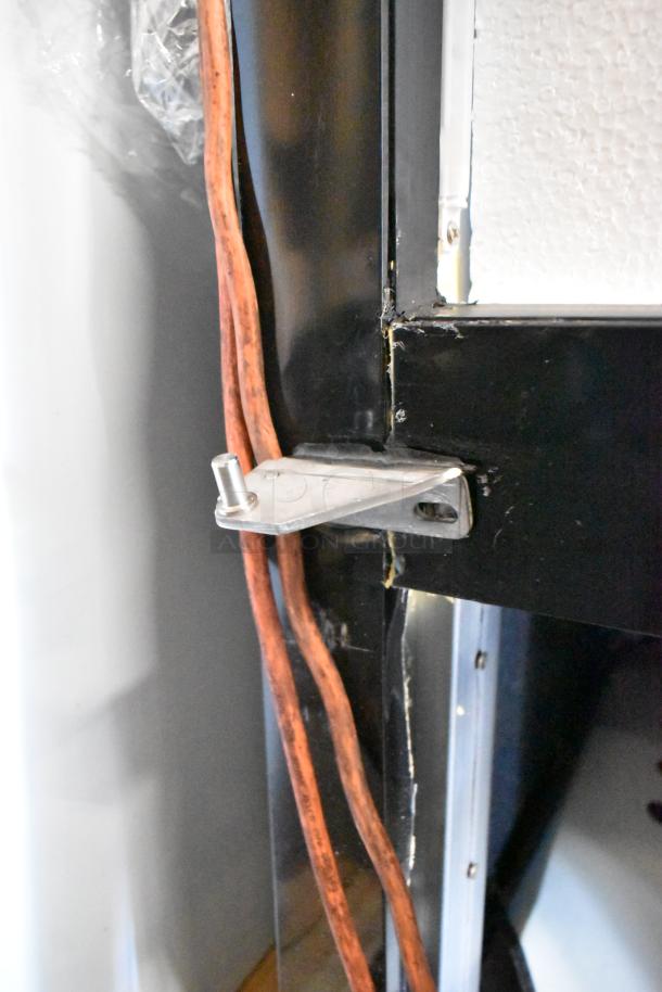 Mainstreet 829GMC49B cooler hinge detail, showing minor scratches on metal edge. Poly-coated racks not visible. 115V, 1P.