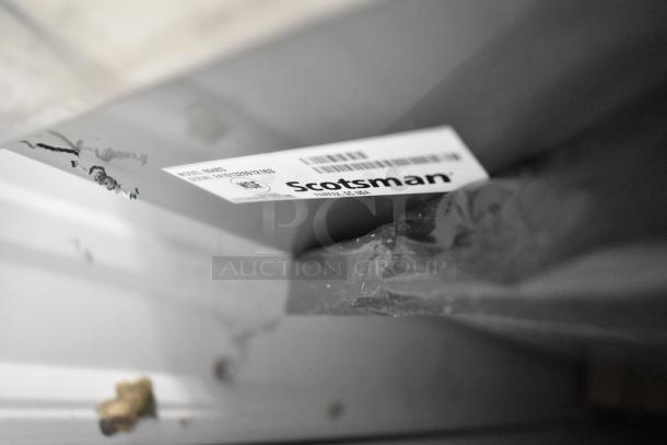 Brand new Scotsman B948S stainless steel ice bin with scratch and dent. Model label visible.