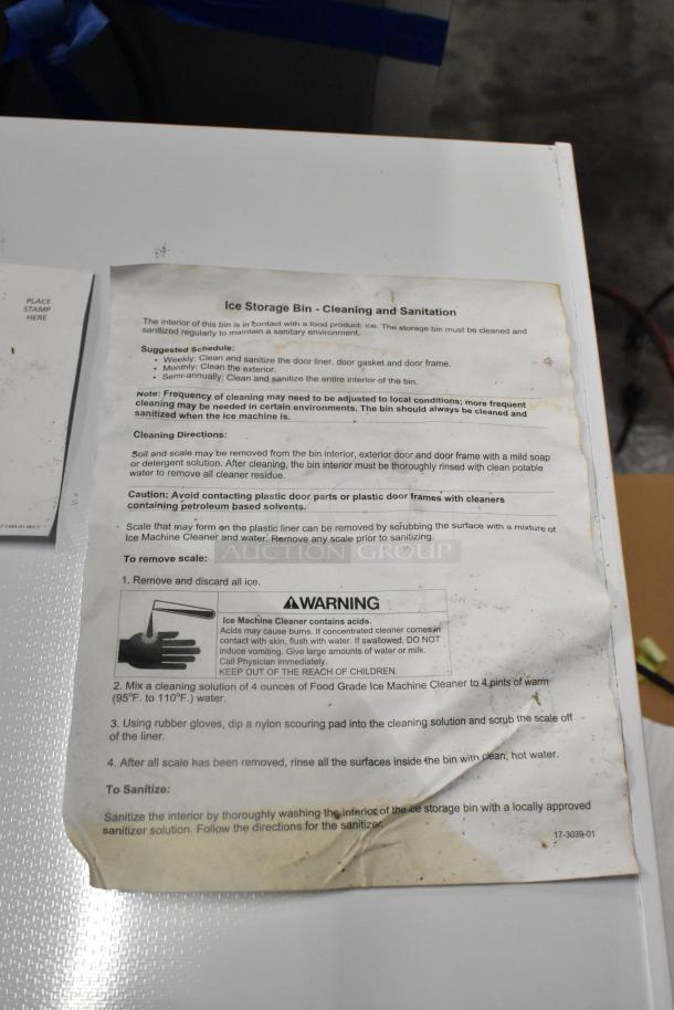 Brand new Scotsman B948S stainless steel commercial ice bin, scratch and dent condition. Cleaning instructions visible.