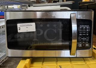 Hamilton Beach Microwave, Model EM031M22C-X1, 1500W, stainless steel, tested & working, auction tag visible on door.