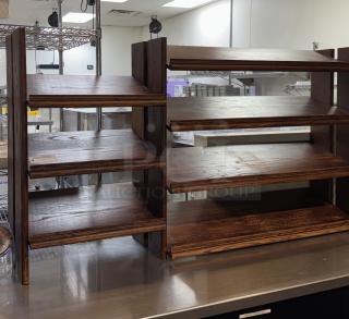 Wooden display case with multiple shelves, dark finish, moderate wear, suitable for showcasing items.