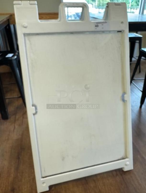 Signature Deluxe portable advertising sign, white, foldable, with carrying handle. Suitable for indoor and outdoor use.