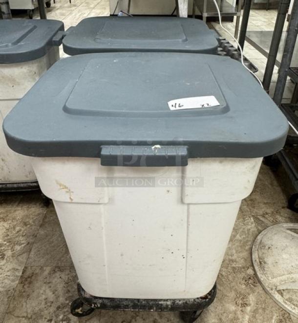 Rubbermaid 28-gallon dry goods container on casters, white with gray lid, some wear visible. Marked with "46 x2."