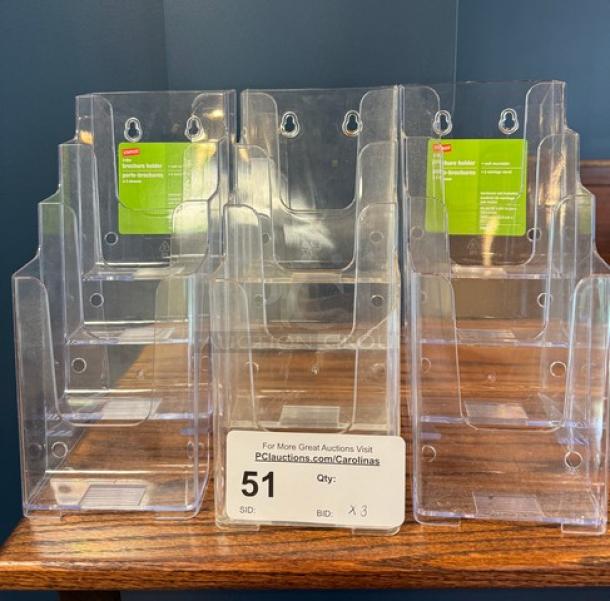 4 Tier Plastic Brochure Stand/Holder, clear with green labels, wall-mountable, lot of 3, new condition.