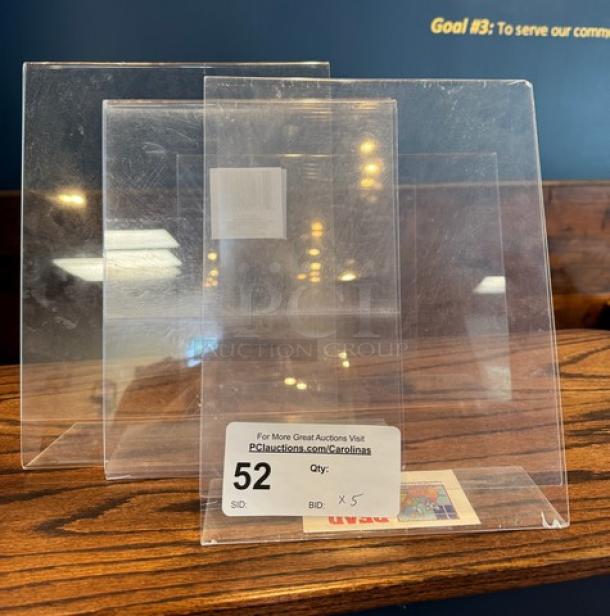 Clear acrylic advertisement holders, set of five, with subtle scuff marks. Lot tag reads: "For More Great Auctions Visit, pciauctions.com/Carolinas, SID: 52, Qty: 5, Bid: X".
