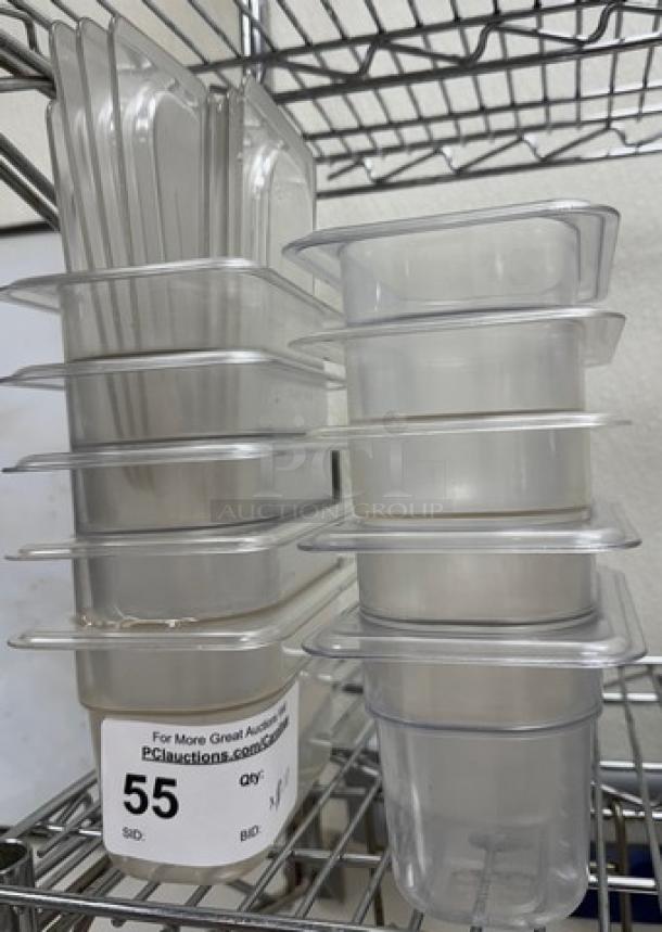 1/6 x 4 acrylic pans with lids, stack of 10. Clear, durable, used condition. Auction label indicates lot number 55.