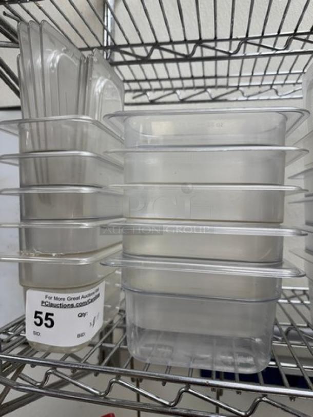 1/6 x 4 acrylic pans with lids, set of 10, in excellent condition, stacked on a metal shelf. Auction tag with lot number 55 visible.