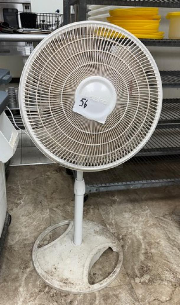 Lasko floor fan, white, tested and working. Features adjustable height and tilt. Base shows signs of wear.