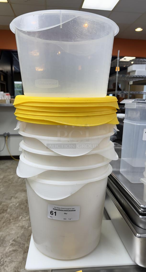 Rubbermaid round plastic containers with yellow lids, set of six, stackable, auction label shows lot 61, bid x5.
