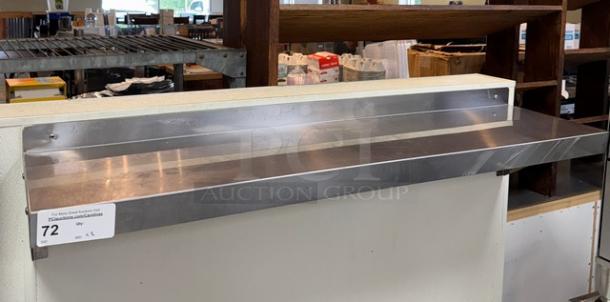 Stainless steel shelving, one 48x10x12 and one 24x10x12, wall-mounted, in excellent condition, with visible mounting hardware.