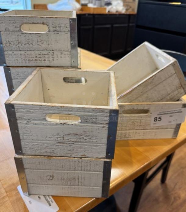 Assorted square wooden display/storage boxes, rustic finish, cutout handles, quantity 7, minor wear, ideal for decor or organization.