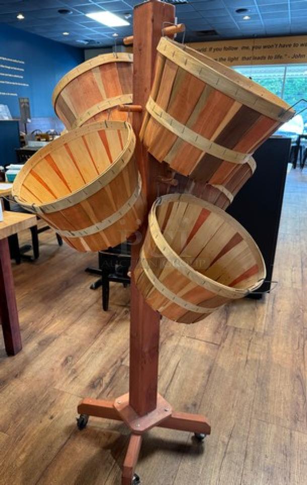 Wooden basket floor display with five tiered baskets, rotatable base, and rustic finish. Ideal for retail or home use.