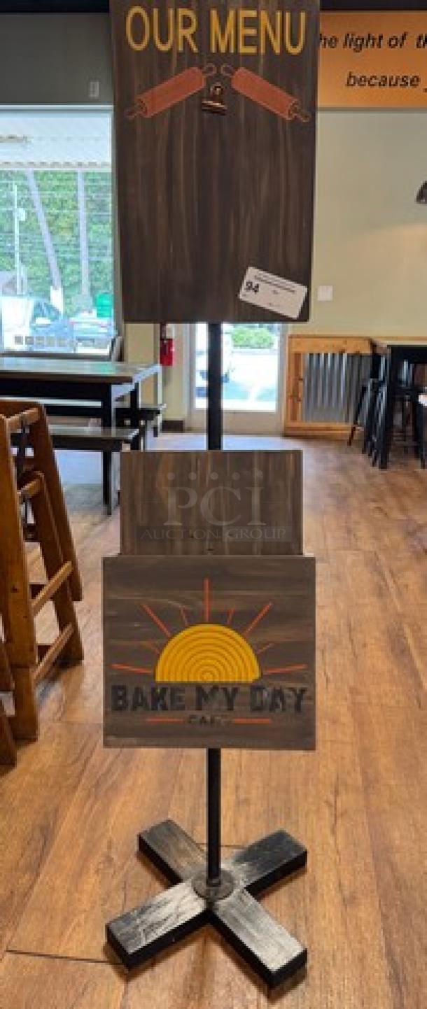 Decorative wooden menu floor sign with "Our Menu" and "Bake My Day Cafe" designs. Includes a holder for menus. Sturdy base.