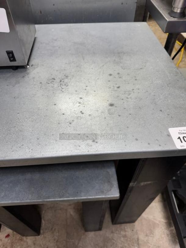 Metal top and wood tables, two sizes: 36x24x32 and 18x17x23. Slight wear on metal surface, sturdy condition. Auction label visible.