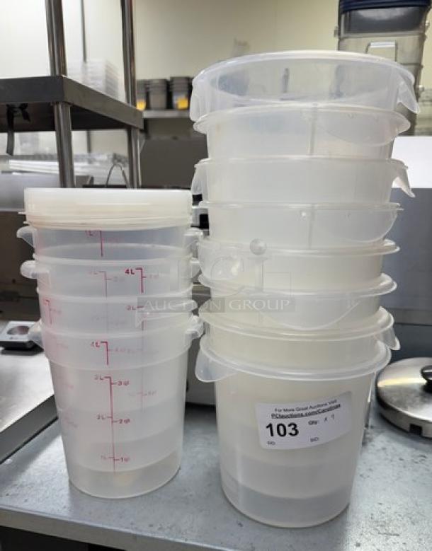 Rubbermaid 4 Qt. round containers with lids, stack of 13, clear plastic, marked with red measurements, auction lot label visible.