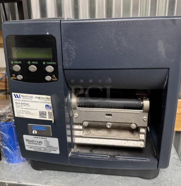Westmark Labeling System, includes 5 rolls of labels, buttons for pause, feed, cancel; visible contact label for Westmark support.