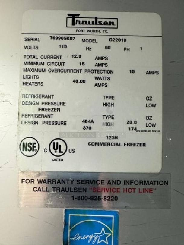 Traulsen 2 Dr. Freezer, Model G22010; inconsistent function; NSF and UL certified; energy sticker visible.