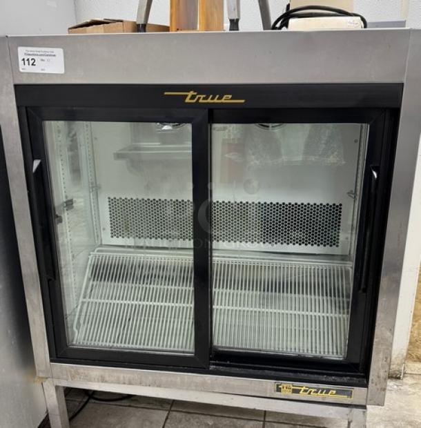 True Refrigerated Display Case, model TSD-09G-LD, glass doors, stainless steel frame, tested & working condition, with brand logo.