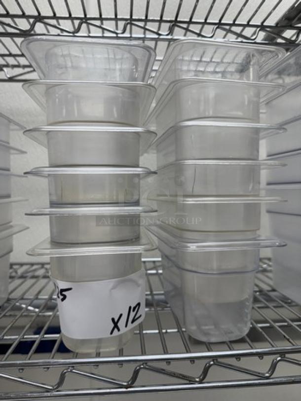 Twelve acrylic pans, size 1/6 x 4, stacked. Clear material on metal shelving. Label reads "x12." Excellent condition.